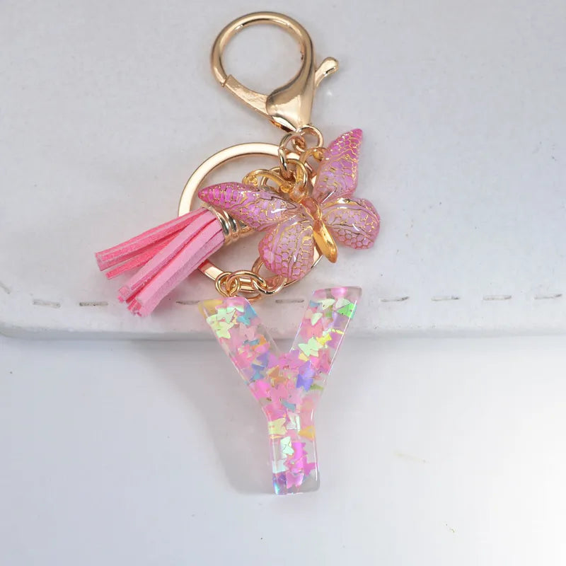 Pink Glitter Initial With Butterfly Charm Keyrings