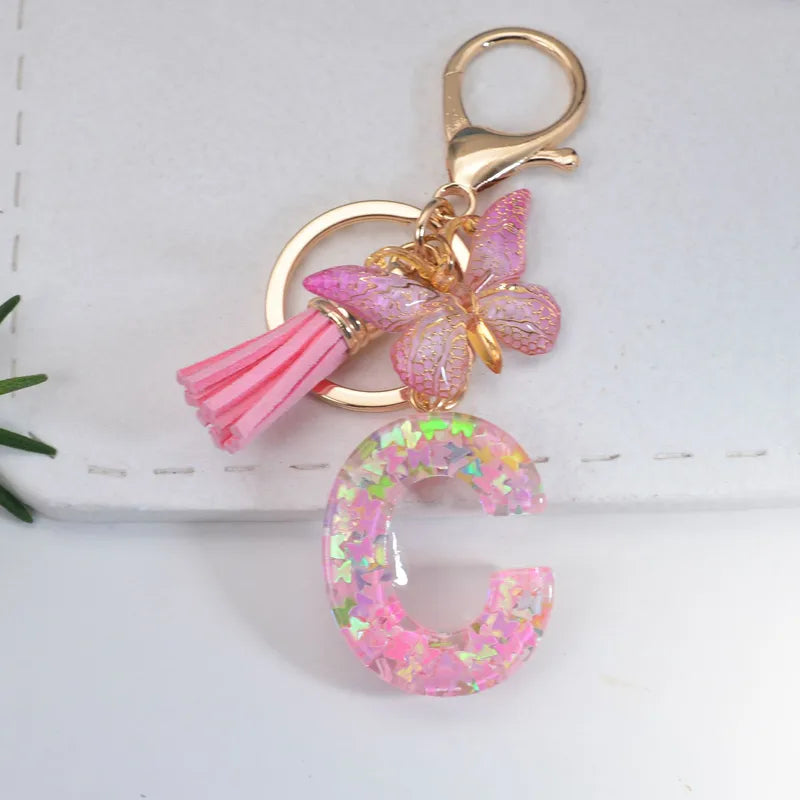Pink Glitter Initial With Butterfly Charm Keyrings